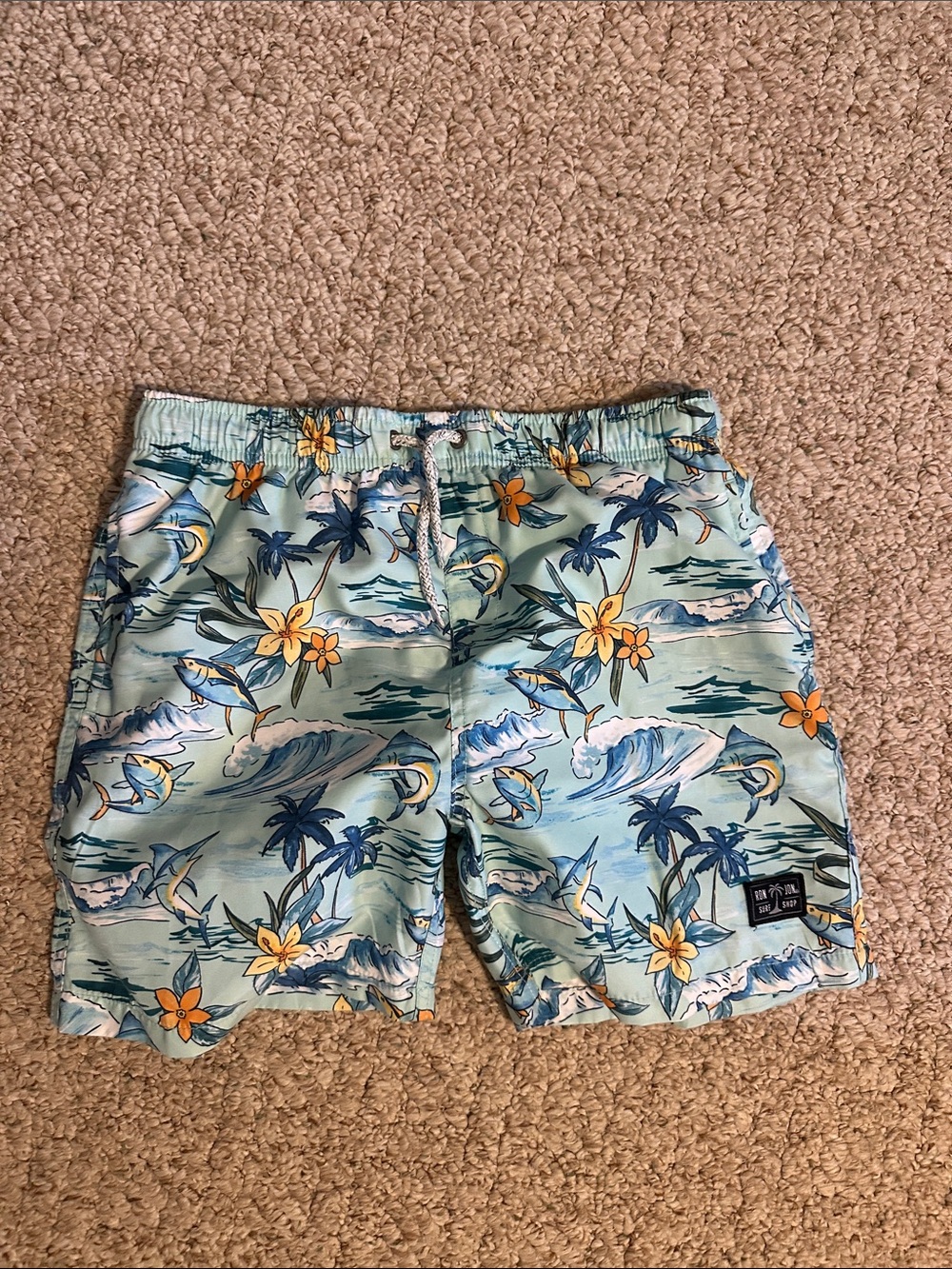 Kids Light Blue Tropical Swim Trunks with Yellow Floral Accents